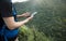 Woman hiker using smartphone