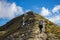 Woman hiker walking on an alpine section of the Kepler Track