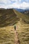 Woman hiker walking on an alpine section of the Kepler Track