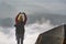 Woman hikers take a picture with backpacks