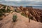 Woman Hikes Down Slickrock in Arches National Park