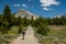 Woman Hikes Toward Lembert Dome in Yosemite
