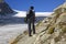 Woman hiking along a glacier