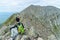 Woman hiking along Knife Edge Trail of Mount Katahdin Northeast Piscataquis Maine USA