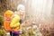 Woman hiking in autumn forest trail