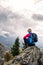 Woman hiking in autumn mountains and woods