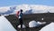 Woman hiking on black sand iceberg beach