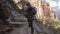 Woman Hiking With Difficulty Climbing The Stone Steps In The Mountain Red Canyon