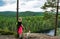 Woman hiking in forest with dog