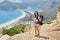 Woman hiking Lycian way with backpack. Fethiye, Oludeniz. Beautiful view of the sea and the beach. Hiking in the mountains of