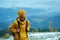 Woman hiking in mountains alone, calm treveler girll peaceful looking away