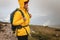 Woman hiking at mountains in extreme weather.