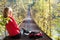 Woman hiking sitting in suspension bridge