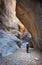 Woman hiking in a slot canyon