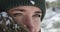 Woman, hiking and snow in winter, face and thinking on peak, fur and eyes closeup. Hiker, vision and climber for