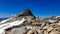 Woman hiking to the Zittelhaus in the summit of mount Hoher Sonnblick in the High Tauern mountains in Carinthia, Salzburg, Austria