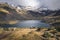 Woman hiking the tranquil trails at Tristaina Lakes, Andorra