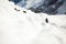 Woman hiking in white winter mountains