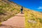 Woman hikking up on mountain stairs at Ponta de Sao Lourenco, Madeira Island