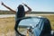 Woman hitch hikes Side mirror on car shows view of motorists stranded Massive traffic pile up on interstate 40 new mexico