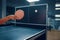 Woman hits ball at the wall, table tennis workout
