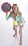 Woman hitting large tennis ball