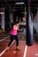 Woman hitting the punching bag