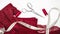 Woman hobby. Workplace of seamstress for sewing underwear. Red, burgundy lace fabric, scissors and sewing accessories