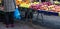 Woman hoding blue plastic bags, buing fruits. Closeup view