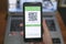 Woman hold covid19 vaccine qr code green pass certificate on a smartphone,tech