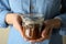 Woman hold jar with caramel condensed milk, close up