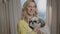 Woman hold shih tzu dog in arms, proud animal owner smile, look at camera Rbbro. Happy smiling