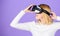Woman hold vr headset glasses violet background. Digital device and modern opportunities. Virtual reality and future