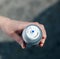 Woman holding aerosol bottle with canned compressed air