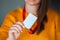 Woman holding badge name tag, with blank space mock up