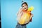 woman holding bag with garbage on blue background pollution cleaning industry