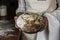 A woman holding a baked warm volcano bread