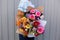 Woman holding beautiful bouquets of flowers