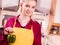 Woman holding bell pepper paprika thinking