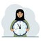 The woman is holding a big clock in his hands. Time management, planning, organization of working time, effective