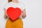 Woman holding a big red box in shape of a heart. Trendy video banner for Valentines Day, International Womens Day or