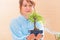 Woman holding bonsai tree