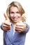 Woman holding both thumbs up