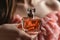 Woman holding bottle perfume smell aroma advertising freshness design elegance fragrance chic liquid luxury exclusive