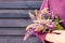 Woman holding the bouquet of colorful lupines