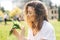 Woman holding a bouquet of lilly of valley flowers