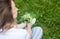 Woman holding a bouquet of lilly of valley flowers