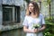 Woman holding a bouquet of lilly of valley flowers