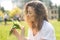 Woman holding a bouquet of lilly of valley flowers