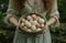 a woman holding a bowl filled with many eggs